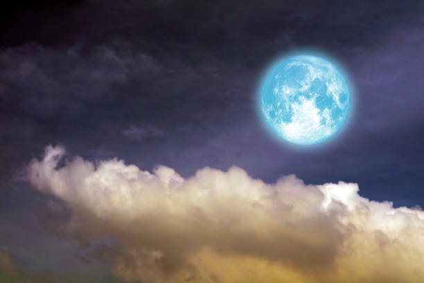 istock full oak moon on night sky and white cloud 1192211711