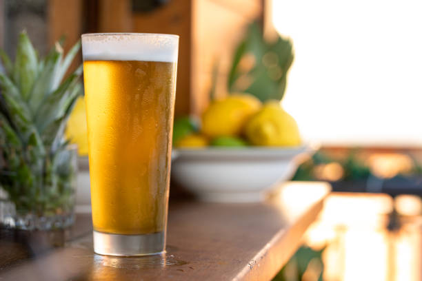 冷たいグラスの中のビール - beer bottle beer drinking pouring ストックフォトと画像