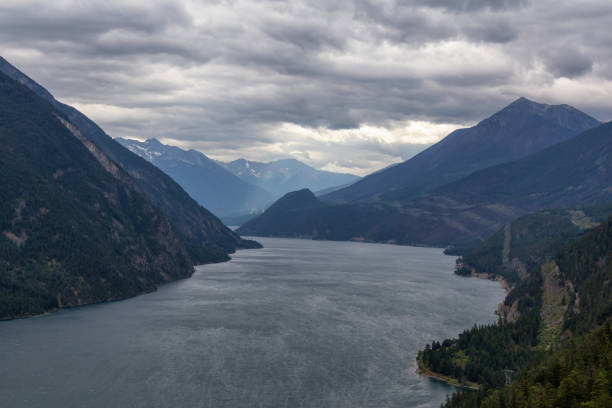 Interior British Columbia, Canada Aerial View of Anderson Lake surrounded by Canadian Mountain Landscape during a cloudy summer day. Located near Lillooet, BC, Canada. pemberton town stock pictures, royalty-free photos & images