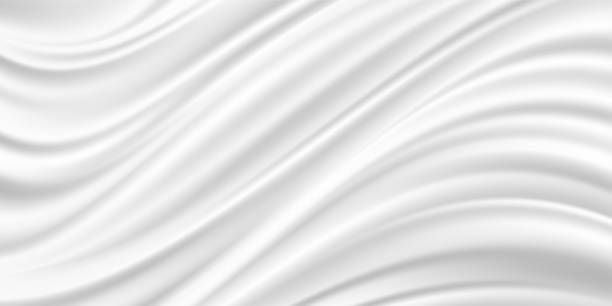 istock Abstract white fabric. Wedding gray and pearl background. Luxurious satin and silk texture. Soft waves background. 1192221565