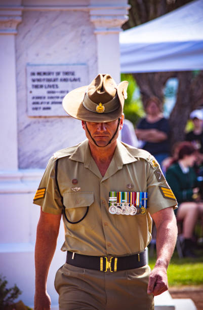 australian army sergeant in traditional uniform, slouch hat and medals marches during anzac day service in cooroy, near noosa in queensland - sergeant imagens e fotografias de stock