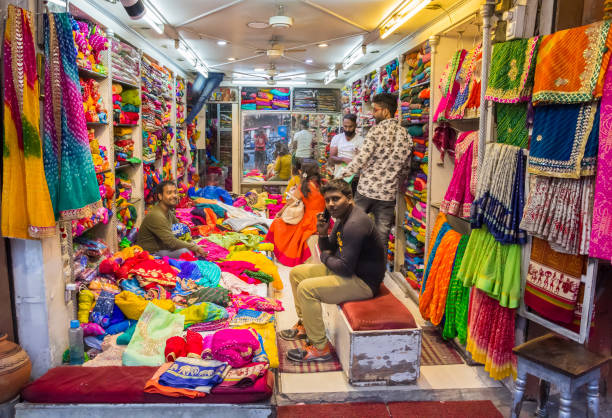 Little wedding shop on a night market in Jaipur Little wedding shop on a night market in Jaipur, India sari stock pictures, royalty-free photos & images