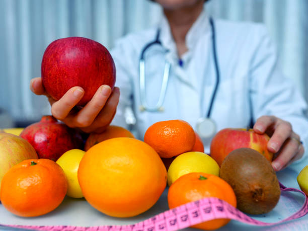 istock Doctor holding apple 1192231135
