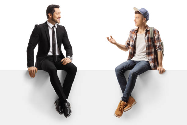 istock Businessman and a male student sitting on a panel and talking 1192231430