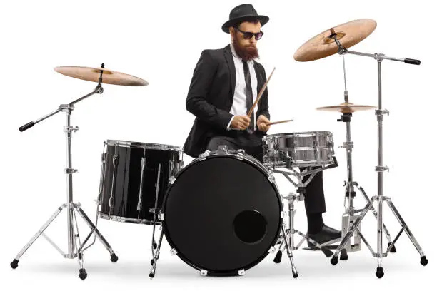 Photo of Elegant male drummer playing a drumkit