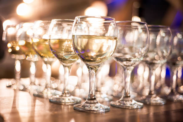 istock rows of wine glasses on corporate party celebration 1192236409
