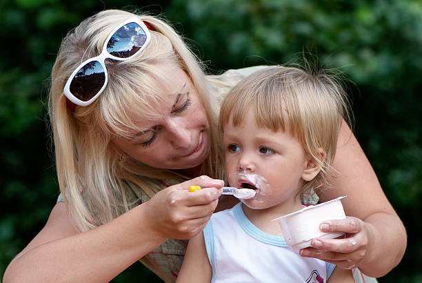 istock Mother and father with young son at park 119223737