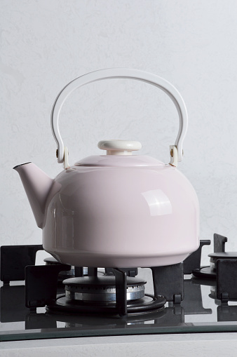 Porcelain Teapot on the Gas Stove