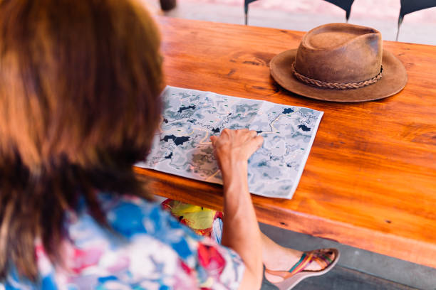 istock Mature woman planning her vacation trip 1192248508