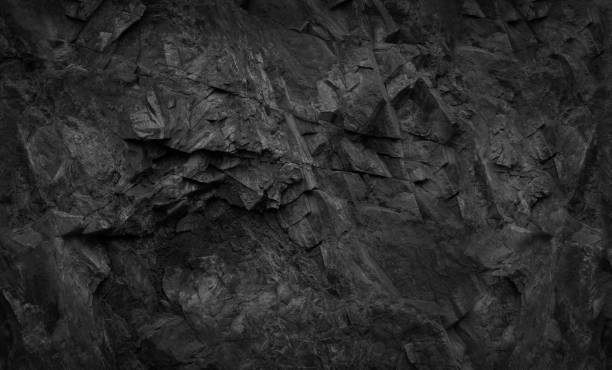 Black stone background. Black rock background. Dark gray stone texture. Black grunge background. Mountain close-up. basalt photos stock pictures, royalty-free photos & images