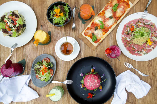istock Various healthy vegetarian dishes served on the restaurant table 1192250356