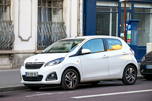 Versailles, France - September 15, 2019: White compact car Peugeot 108 in the city street.