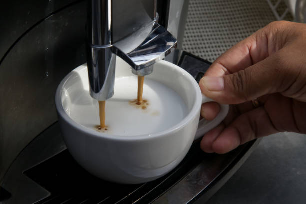 istock Close up of barmen hand brewing coffee 1192250531