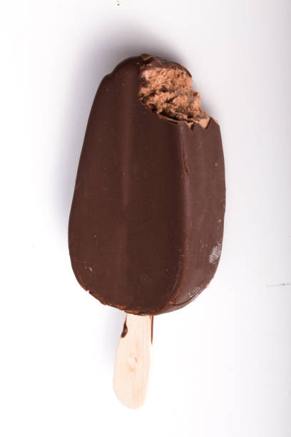 istock ice cream in the chocolate on white 1192251242