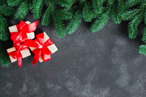 istock Christmas background with fir tree and Christmas gift boxes. Top view with copy space 1192253880