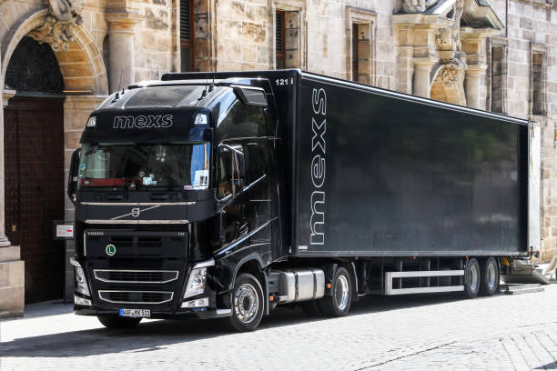 Volvo FH12 Nuremberg, Germany - September 19, 2019: Black semi-trailer truck Volvo FH12 in the city street. volvo photos stock pictures, royalty-free photos & images