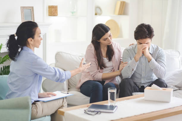 istock Loving wife supporting her husband during psychotherapy session 1192256333