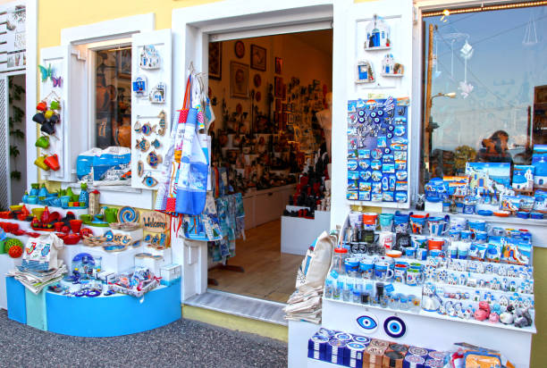 Fira in Santorini, Greece - June 15, 2017: A colorful souvenir shop in the town of Fira.The Greek island of Santorini in the southern Aegean Sea with its characteristic white houses is considered to be one of the most beautiful holiday destinations in the world.