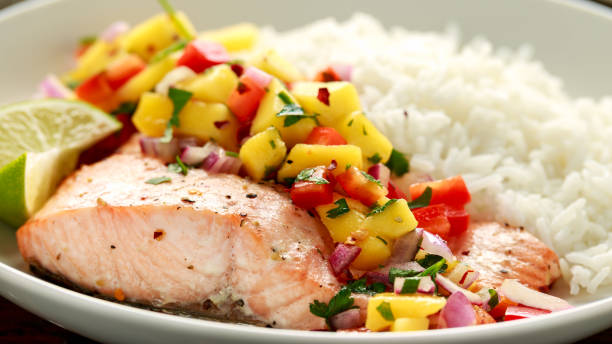 istock Salmon with mango salsa and white rice on plate 1192258484