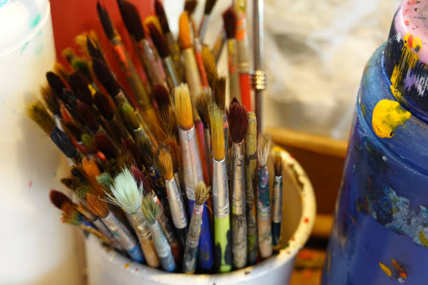 istock Many old paintbrush in a white glass. paints and brushes 1192260038