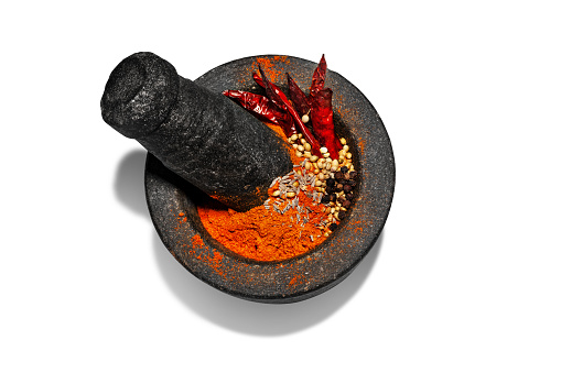 Granite mortar and pestle with spices  for grinding