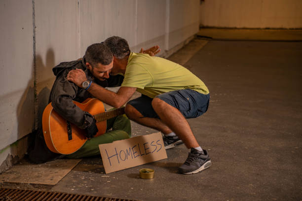 istock Man is Helping Beggar in the Street 1192260315
