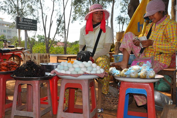 Phnom Pehn, Cambodia - March, 05, 2011: vendors women selling local food at The Central Old market in the capital Phnom Penh, Cambodia, Asia