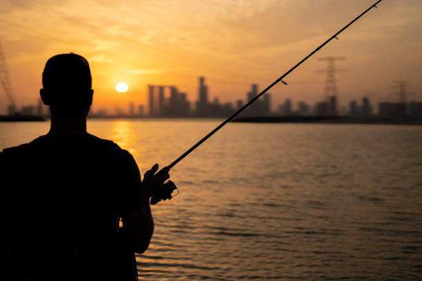 istock Angler and its last cast before sunset 1192262716