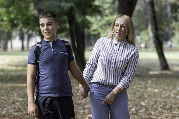 istock Young Boy is Going to the School with his Mother 1192263001