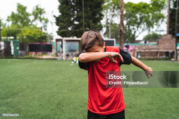 Soccer Player Boy Doing The Dab Dance Standing On A Soccer Field Stock Photo - Download Image Now