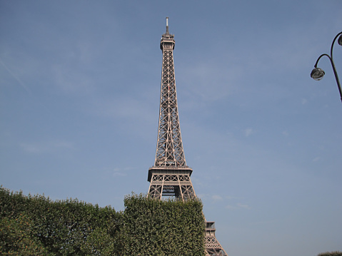 Paris, France - January 1, 2015: Photo of The Eiffel Tower of a wrought iron lattice tower on the Champ de Mars in Paris in France, which is one of the Greatest Tourist Attraction in Europe. It is named after the engineer Gustave Eiffel, whose company designed and built the tower from 1887 to 1889. The tower is 324 meters tall, about the same height as an 81-story building, and is the tallest structure in Paris.