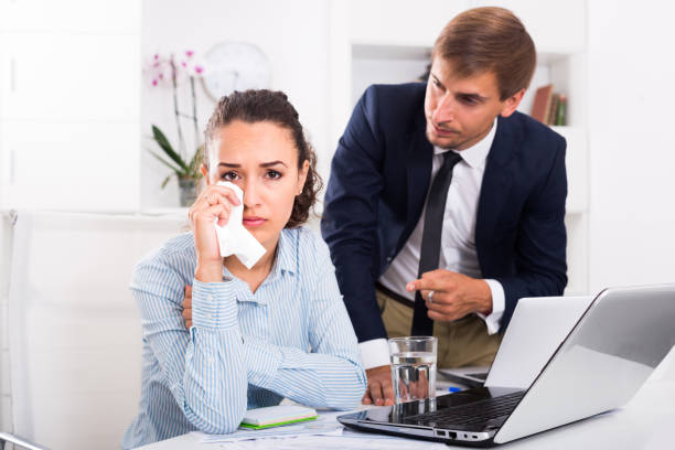istock crying woman in office 1192270045