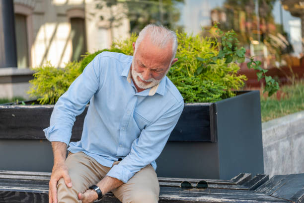 istock Senior Businessman with Knee Problems in the City Streets 1192273365