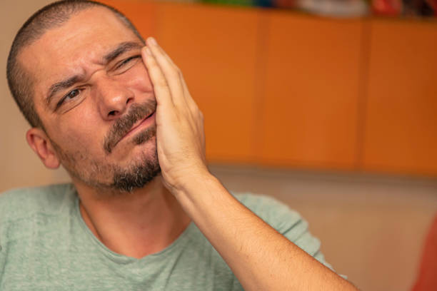 istock Young Man with a Toothache at Home 1192274316