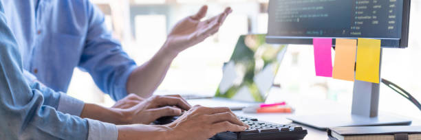 istock Midsection Of Business People Working On Table 1192274466
