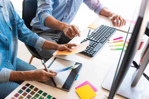 istock High Angle View Of Business People Working On Table 1192274485