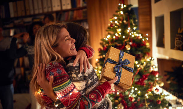 istock Surprise for  Christmas.friends with present at Christmas. 1192274495