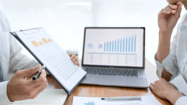 istock Midsection Of Business People Working On Table 1192274859