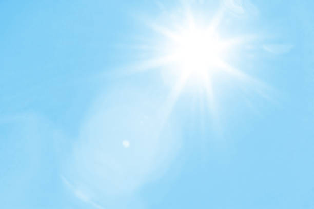 istock Bright sun with beautiful beams in the sky 1192275918
