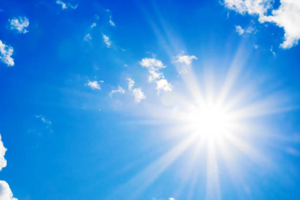 istock Bright sun with beautiful beams in the sky with clouds 1192275933