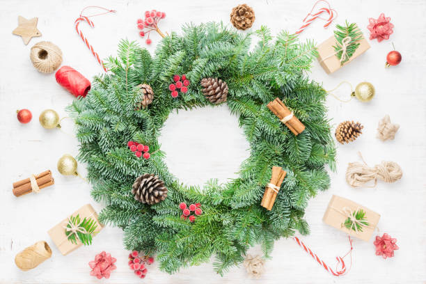 istock Handmade Christmas wreath on white table 1192276799