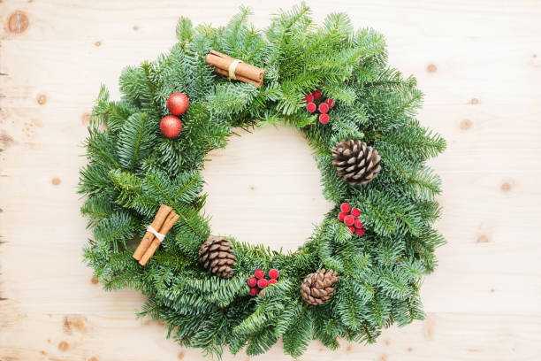 istock Handmade Christmas wreath on wooden table 1192276855