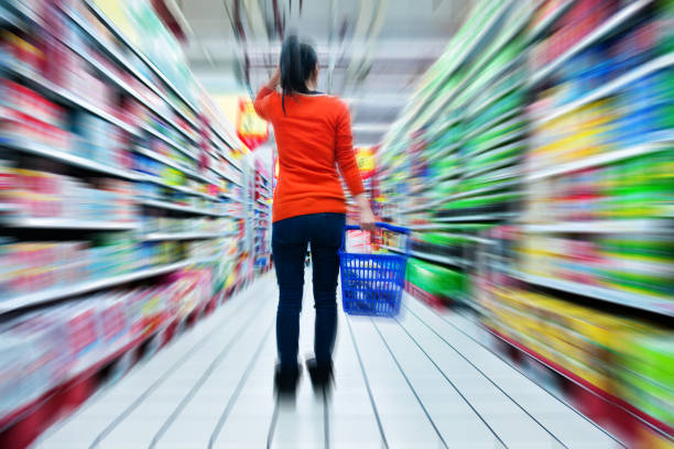 woman holding a shopping basket in shopping mall