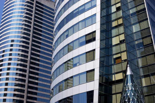 istock Rounded modern glassy office buildings and refelctions at Sathon 1192280109