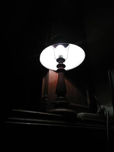 istock Light of lamp in darkness 1192280358
