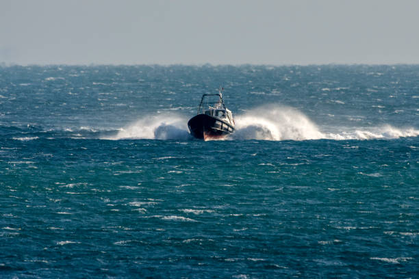 istock Full speed boat on rough sea 1192280397