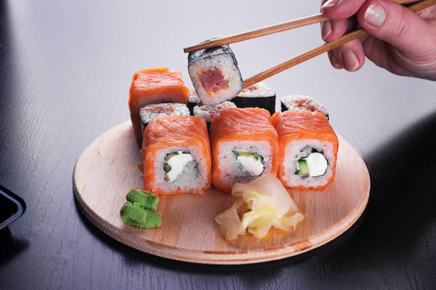 istock California sushi rolls on dark wooden table 1192280619