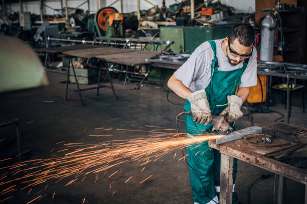istock Man grinder working in factory workshop 1192281542
