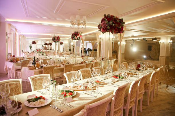 istock Large banquet hall during the wedding celebration decorated with decorative elements and a bouquet of flowers 1192282894