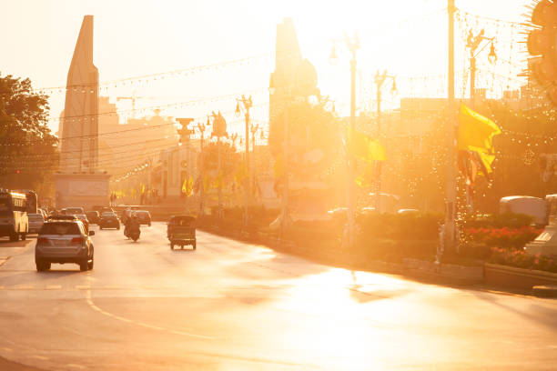 Landscape of Ratchadamnoen Avenue and the Democracy Monument at dusk. City life in the centre of Bangkok, Thailand.